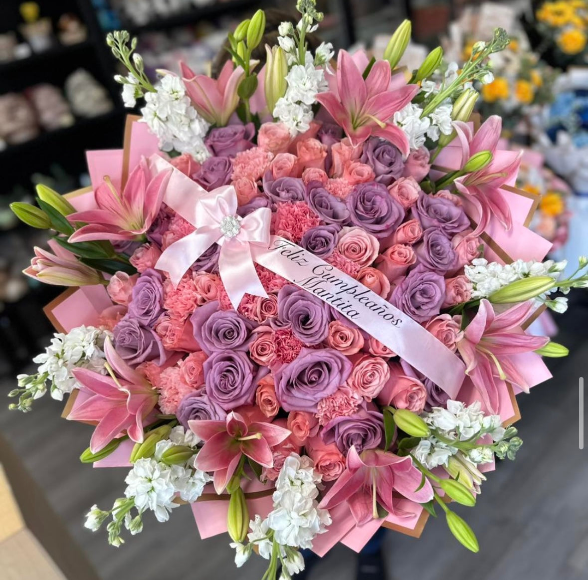 75 roses with Lilys rim