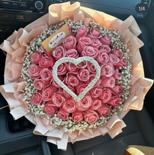 50 roses with baby’s breath heart